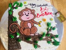 Bánh kem vẽ hình khỉ con trên cành cây
